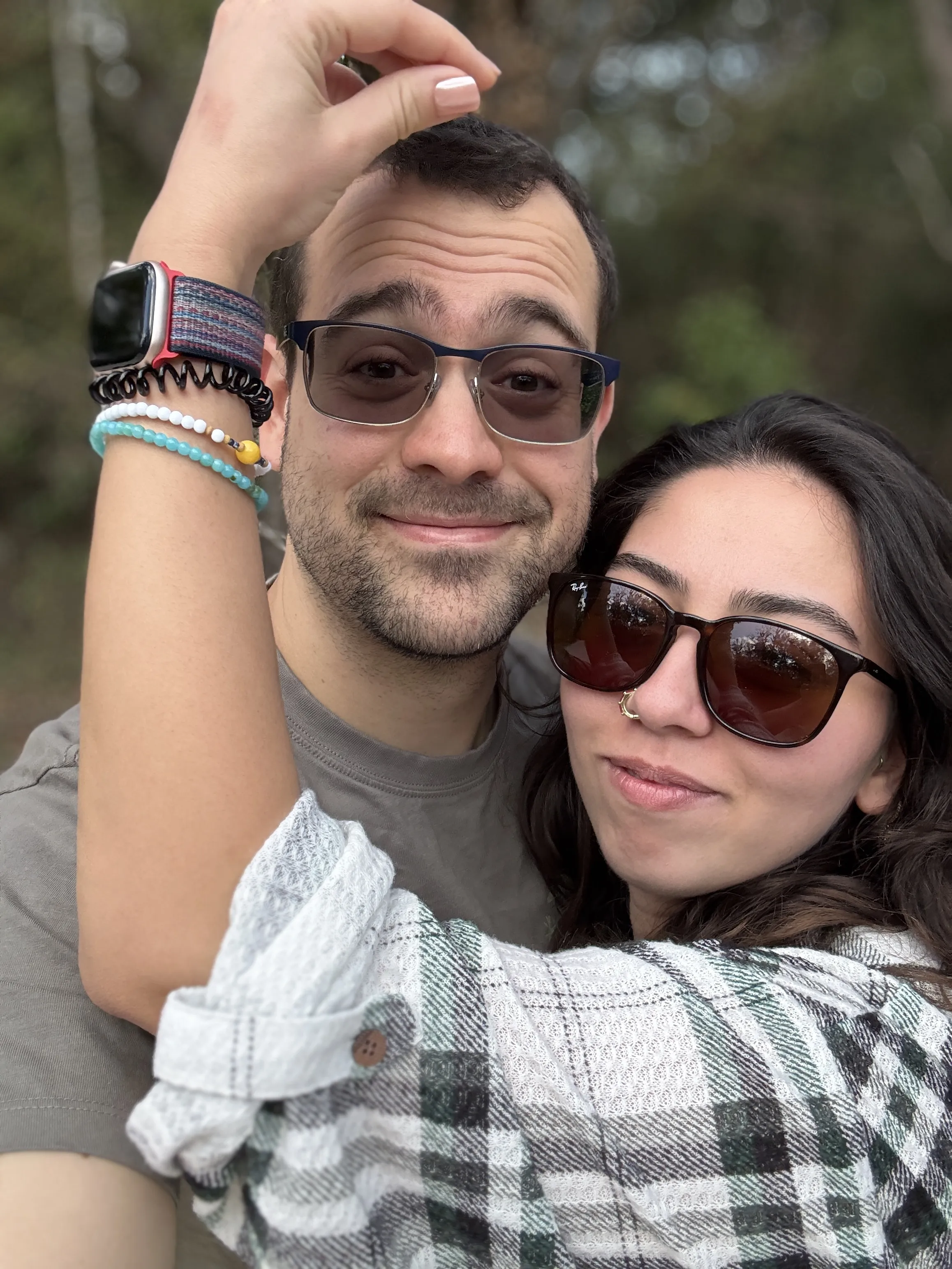 William and Yasemin together outdoors, celebrating their relationship and upcoming wedding.